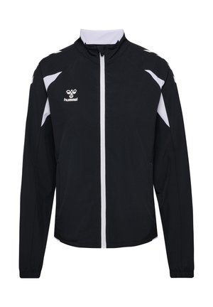 Zwart-witte sportjas met volledige ritssluiting aan de voorkant, hoge kraag, lange mouwen en hummel-logo op de linkerborst.