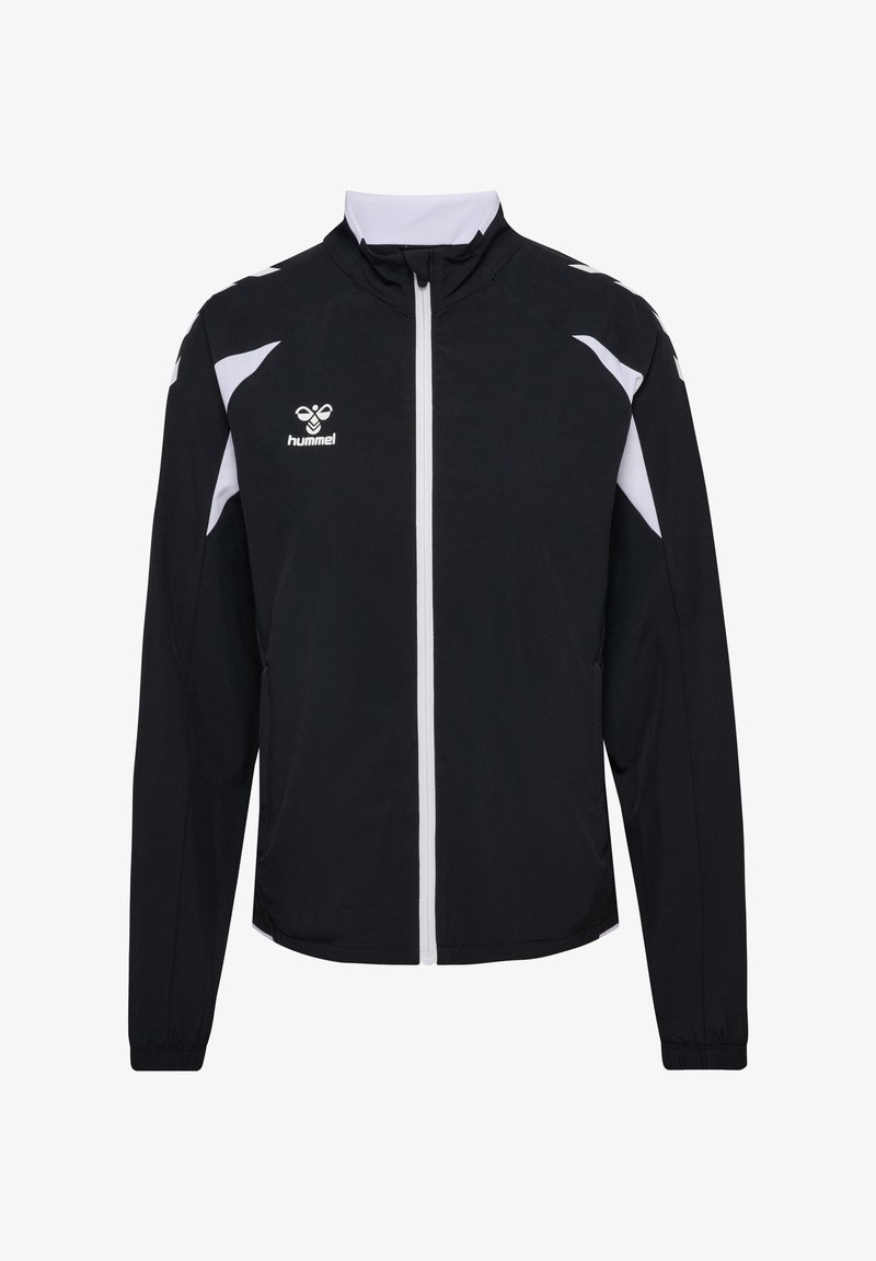 Veste de sport noire et blanche avec fermeture éclair intégrale à l'avant, col montant, manches longues et logo hummel sur le côté gauche de la poitrine.
