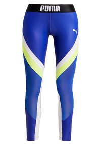 Blå Puma-träningsbyxor med vita och neongula diagonala ränder, svart midja med vit Puma-logotyp och liten Puma-katt-logotyp på låret.