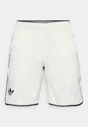 White sports shorts with a smooth texture, featuring side pockets, stitched black accents, and a small dark logo on the left leg.