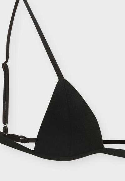 Μαύρο τρίγωνο bralette με λεπτές τιράντες. Κατασκευασμένο από υφή υφάσματος, διαθέτει ρυθμιζόμενες τιράντες και απλό σχέδιο.