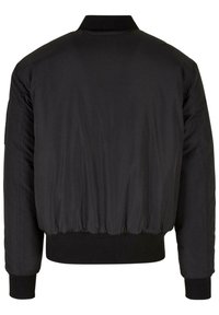 Chaqueta bomber negra con cuello redondeado, puños elásticos y dobladillo fruncido. Tejido suave con un detalle mínimo en la parte posterior.
