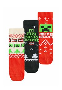 Drei Paar Socken: rot mit Weihnachtsmotiven, schwarz mit einem grünen Creeper-Graphic und cremefarben mit TNT-Blöcken und Bäumen, alles im Strickdesign.