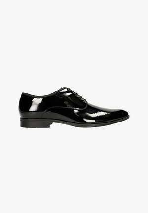 Scarpe eleganti nere in vernice con punta arrotondata, finitura liscia, design con lacci e tacco basso e piatto. Nessun motivo o accento visibile.