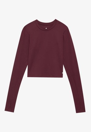 Bordeaux langermet crop topp i myk stoff, med rund hals, tettsittende ermer og sideslisser i kanten.