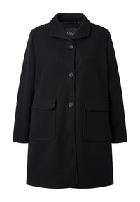 Cappotto di lana nera con colletto, bottoni frontali e due tasche a toppa sui lati. Tessuto liscio e taglio su misura, leggermente oversize.