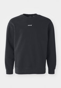 Svart sweatshirt i bomull med rund hals, långa ärmar och en liten vit "LEVI'S"-logotyp på bröstet.