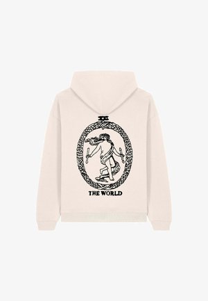 Hoodie color beige chiaro con una grafica nera di una figura all'interno di un ovale circondata da un bordo decorativo, con testo che recita "IL MONDO."