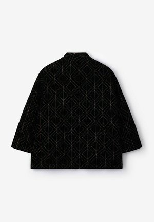 Black jacket with short sleeves, featuring a geometric pattern in metallic tones, made from textured fabric, and a classic collar design.