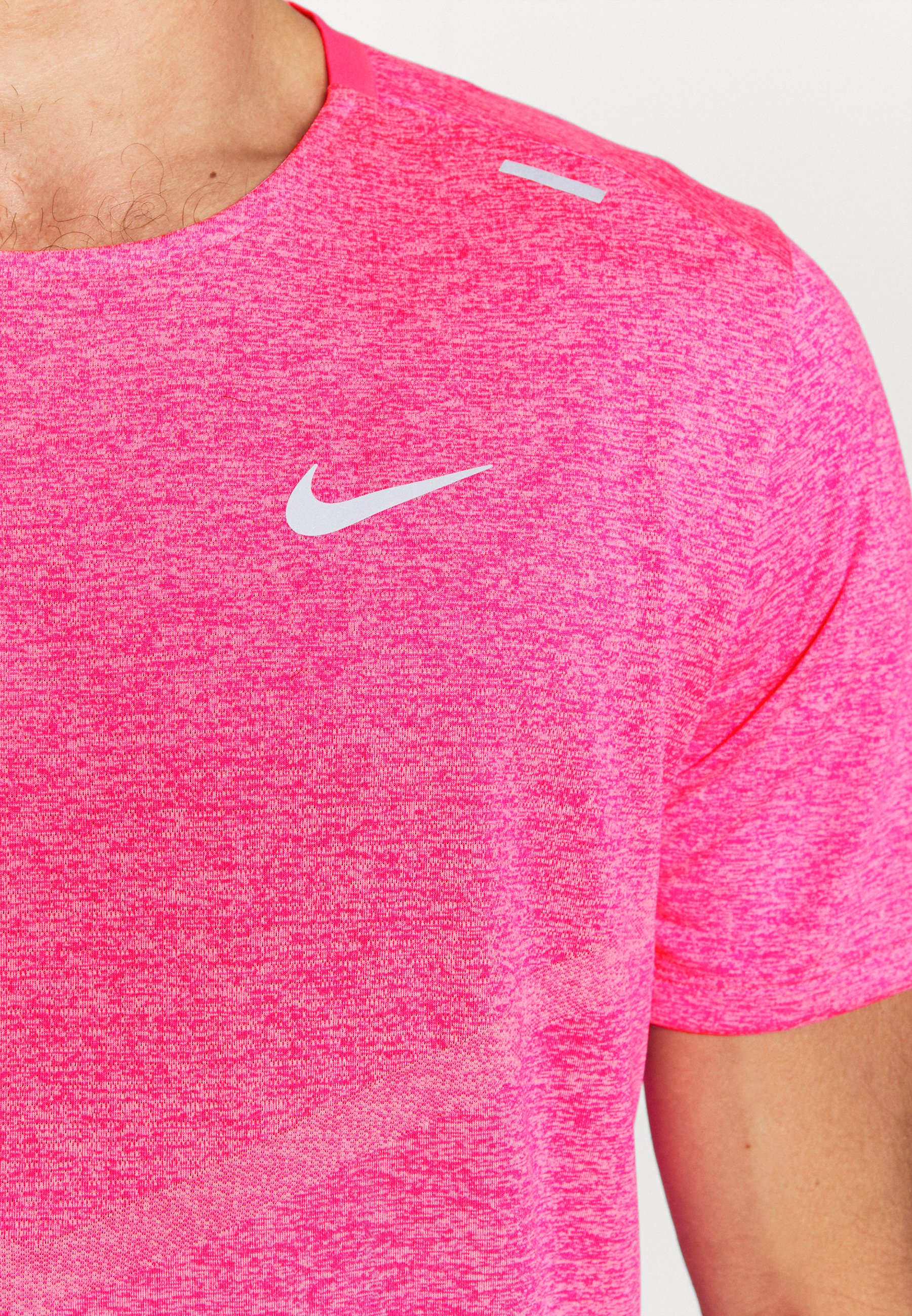 pink and teal nike shirt
