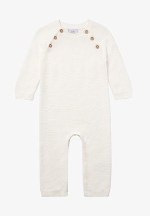 Barboteuse pour bébé en tricot couleur crème, à manches longues, avec quatre boutons en bois près de l'encolure arrondie.