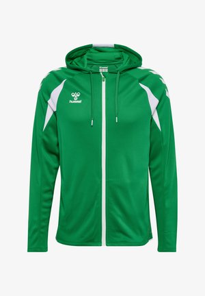 Grüner Sport-Hoodie mit weißem Reißverschluss, weißen Chevron-Akzenten auf den Schultern, Fronttaschen und Hummel-Logo auf der linken Brust.