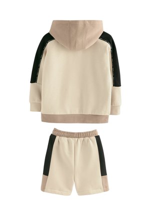 Hættetrøje og shorts sæt i beige, sort og brun. Glat stof, farveblokering og ribbede manchetter på ærmerne og taljen.