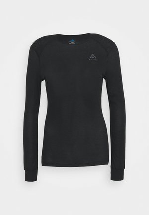 Black long-sleeve shirt made of soft material. Features a round neck, fitted design, and subtle logo on the chest. Ribbed cuffs.