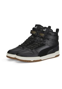 Black high-top sneakers made of leather with a textured finish, featuring a white midsole, black laces, and Puma branding in gold.