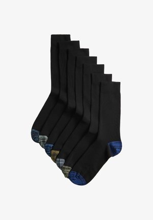 Sept paires de chaussettes noires montantes avec talons et orteils renforcés, dans différentes couleurs comprenant le bleu, le gris et le vert olive.
