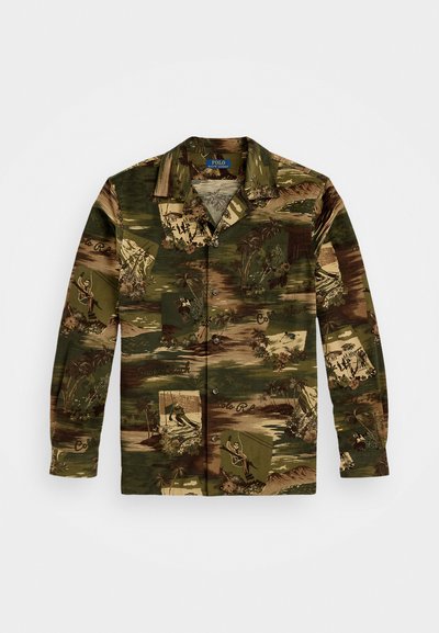 Short-sleeve shirt with a green, brown, and beige patterned fabric, featuring illustrations, palm trees, and button detailing.