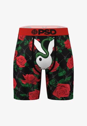 Calzoncillos bóxer negros con rosas rojas, hojas verdes y un logo de conejo blanco. Cinturilla roja con marca; detalle de malla alrededor del logo.