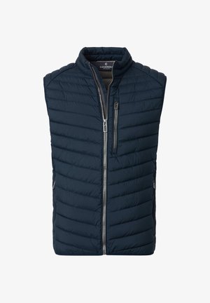 Navyblå quiltet ærmeløs vest med lynlåslommer foran og på brystet samt lukning med sølvfarvet lynlås.