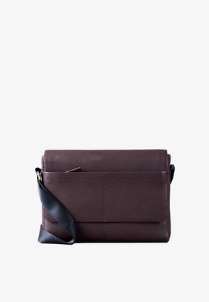 Brown leather messenger bag with a flap closure, vertical seam details, front pocket, and an adjustable black strap.