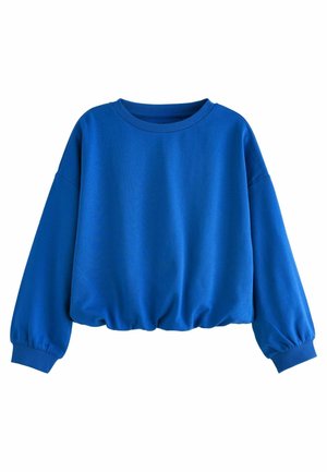Sweat-shirt bleu à manches longues avec col rond, poignets et ceinture côtelés, présentant une coupe ample légèrement froncée en bas.