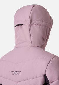 Purple insulated jacket with a hood, featuring a logo on the back and a drawstring for adjustment. Smooth, lightweight fabric.