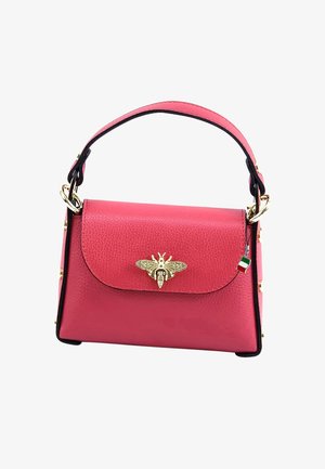Pink leather handbag with a structured shape, gold bee emblem on the front, black accents, and a short handle.
