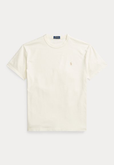 T-shirt de manga curta, com gola redonda, na cor marfim, feito de algodão suave. Apresenta um pequeno logótipo bordado no peito esquerdo. Corte clássico e relaxado.