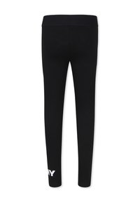 Leggings neri con una ampia vita elasticizzata. Il tessuto è morbido e ha un design aderente. Un dettaglio del logo bianco è visibile sulla parte bassa della gamba.