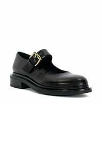 Black leather Mary Jane shoe with chunky sole and wide strap secured by large gold buckle, shown on white background.