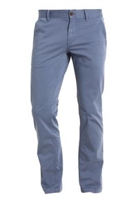 Ljusblå bomullschinos med rak benpassform, framknäppning och diskreta sömdetaljer. Slät yta och platt frontdesign.