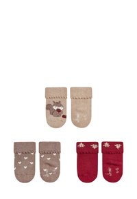 Set aus vier Paar Kinderstrümpfen. Zwei beige mit Eichhörnchen-Motiv; zwei braune mit weißen Herzen; zwei rote mit Lebkuchenmännchen. Strickstruktur.