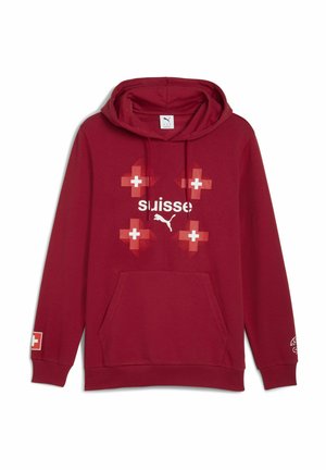 Rød hoodie med en frontlomme i kengurustil. Udstyret med hvid "suisse" tekst og mønstre med det svejtsiske kors. Lavet af blødt stof, med lange ærmer og hætte.