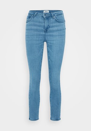 Light blue denim skinny jeans with a smooth texture, traditional five-pocket design, and a button-fly closure. Simple and classic cut.