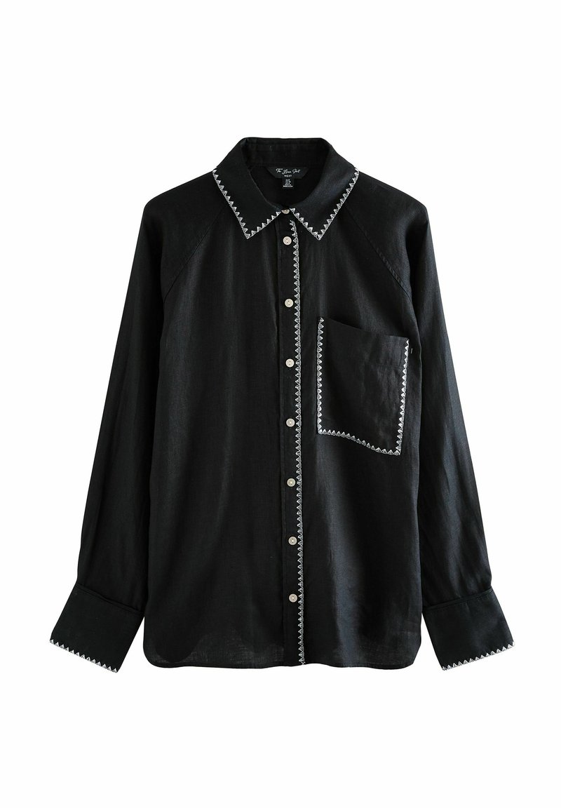 Schwarzes Langarmshirt aus Leinenmaterial, kontrastierender weißer Stickerei entlang des Kragens und der Tasche, Knopfschluss, lockere Passform, eine Brusttasche.