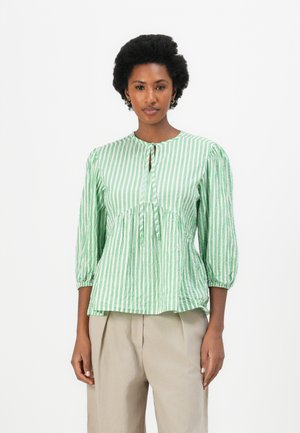 Green and white striped blouse with a gathered waist, round neckline, and three-quarter sleeves, featuring a keyhole detail at the front.