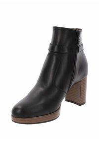 Zwarte leren enkelboot met een ronde neus, ritssluiting en een houten blokhak. Beschikt over een gladde textuur en minimale stikseldetails.