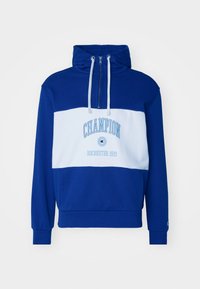 Niebieska i biała bluza z kapturem z zamkiem błyskawicznym, z napisem "CHAMPION" oraz "ROCHESTER 1919" w jasnoniebieskim kolorze. Wykonana z miękkiego materiału.