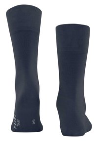 Marina strumpor tillverkade av texturerat material med ribbat mudd, som visar storlek och varumärkeslogotyp på sidan. Två vyer visas.