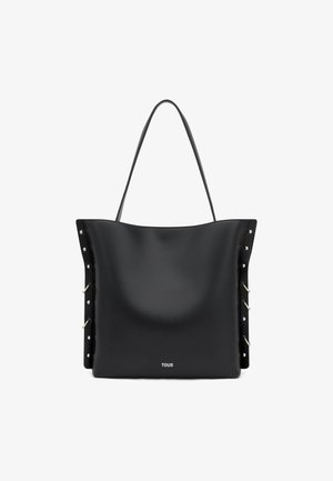 Borsa tote in pelle nera con manici sottili, dettagli con borchie e fibbie sui lati e logo TOUS al centro in basso.