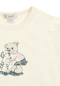 T-shirt in cotone color crema con una stampa grafica giocosa di un orsetto e un cucciolo, con dettagli a volant sulle maniche e scollatura rotonda.