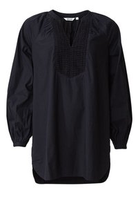 Svart tunika av bomull med en plisserad halsringning, långa ärmar med elastiska manschetter och en något längre baktill.