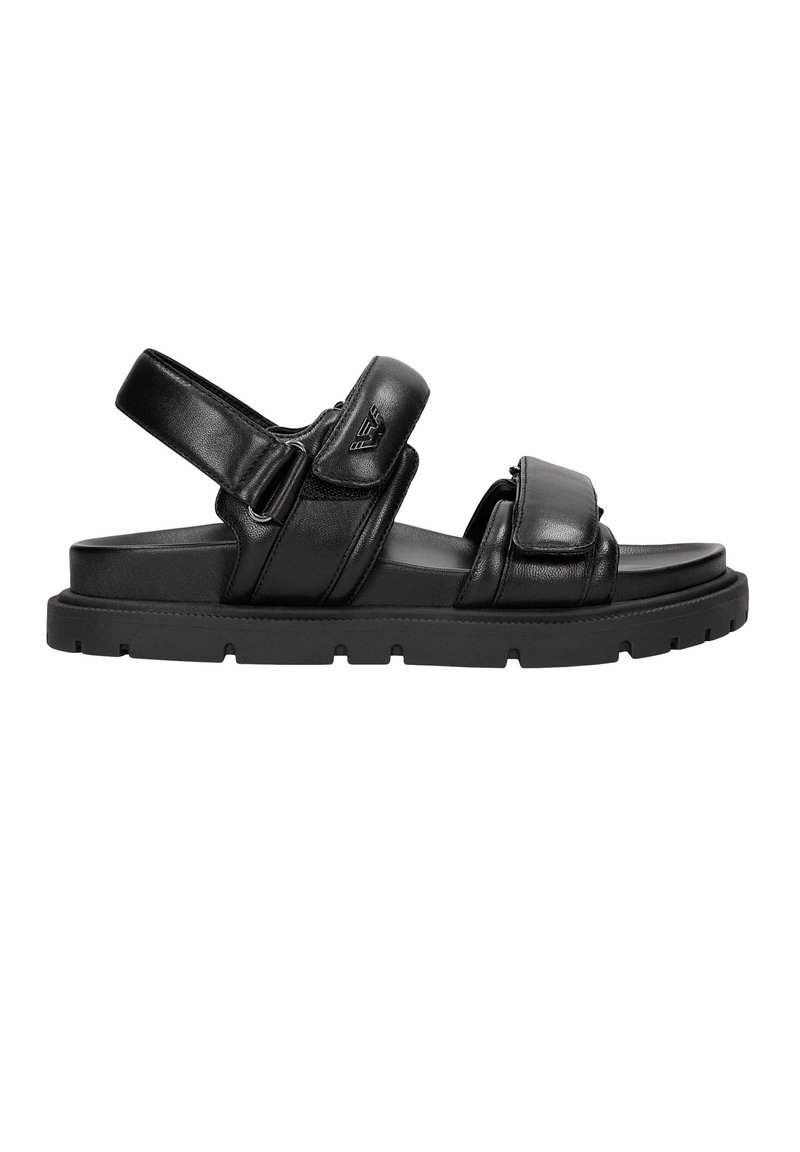 Sandali neri in pelle con cinturini regolabili, suola piatta e resistente, e design minimalista. Presentano dettagli di cucitura e un logo.