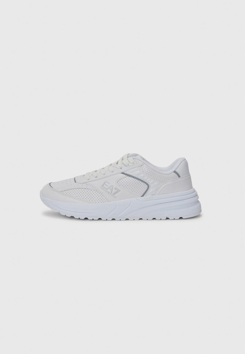 White athletic sneaker with a mesh texture, perforated upper, and rubber sole. Features light gray accents and lace-up closure.