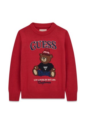 Pull en maille rouge avec un ours en peluche portant un chapeau et une chemise noire, texte "GUESS" au-dessus et "Los Angeles EST. 1981 California" en dessous.