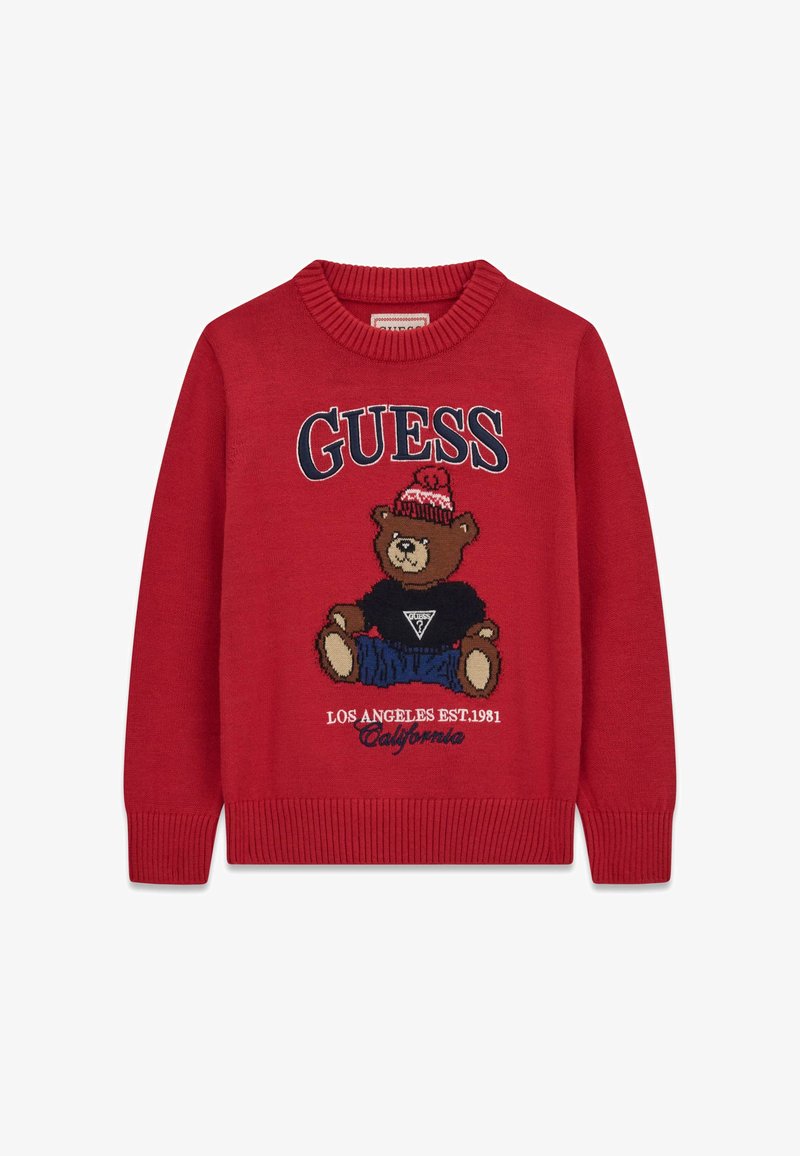 Pull en maille rouge avec un ours en peluche portant un chapeau et une chemise noire, texte "GUESS" au-dessus et "Los Angeles EST. 1981 California" en dessous.
