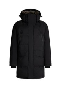 Zwarte gewatteerde parka met een hoge kraag, voorrits, twee met rits sluitende borstzakken en twee grote voorzakken. Zachte binnenvoering.