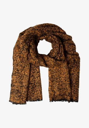 Bufanda gruesa de punto en tonos marrones con motas negras, doblada con un lazo en el centro y con flecos en los extremos.