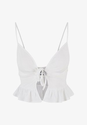 Hvid ribbet crop top med justerbare spaghetti-stropper, frontlukning med bånd og rynket kantdetalje. Blød tekstur og tætsiddende design.