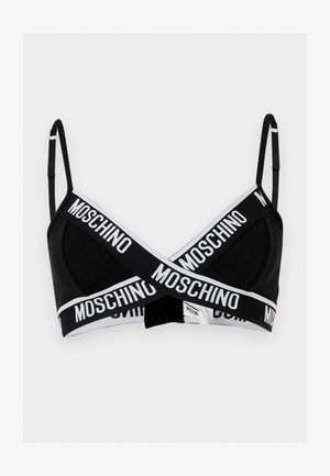 Μαύρο σουτιέν bralette με λεπτές ρυθμιζόμενες τιράντες και λευκές ελαστικές ταινίες που διασταυρώνονται μπροστά, με επαναλαμβανόμενο λογότυπο Moschino σε έντονα γράμματα.
